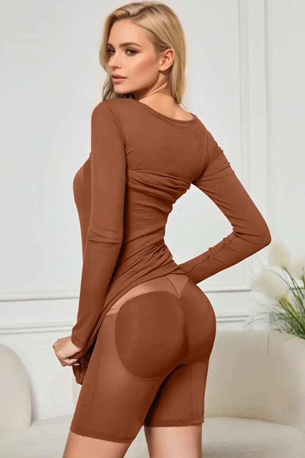 Woman wearing a brown long sleeve neck dress with built-in shapewear, emphasizing a smooth silhouette and confidence boost.