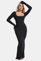 Woman wearing black neck long sleeve dress with shapewear technology, sleek silhouette, square neck design.