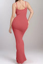 Woman wearing a sleeveless red maxi dress with built-in shapewear, offering seamless comfort and an elegant silhouette.